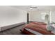 Bedroom with hardwood floors and modern ceiling fan at 9415 W Eaton Rd, Phoenix, AZ 85037