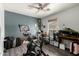 Bedroom featuring a ceiling fan, gray accent wall and used as a home gym at 9415 W Eaton Rd, Phoenix, AZ 85037