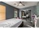 Cozy bedroom with ceiling fan and closet at 9415 W Eaton Rd, Phoenix, AZ 85037