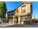 Two story home with a two-car garage, desert landscaping, and a tiled roof at 9415 W Eaton Rd, Phoenix, AZ 85037