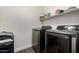 Laundry room with modern washer and dryer set at 9415 W Eaton Rd, Phoenix, AZ 85037