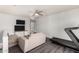 Spacious upstairs living room with comfortable seating, large TV, and an indoor treadmill at 9415 W Eaton Rd, Phoenix, AZ 85037