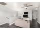 Upstairs loft style living room with comfortable seating and a TV at 9415 W Eaton Rd, Phoenix, AZ 85037