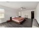 Spacious primary bedroom with platform bed, neutral walls, and hardwood flooring at 9415 W Eaton Rd, Phoenix, AZ 85037