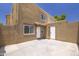 Private backyard with a concrete patio, a block wall surround, and convenient access doors at 948 S Alma School Rd # 1, Mesa, AZ 85210