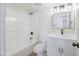 Clean bathroom features modern fixtures, a shower-tub combo, and vanity with quartz countertop at 948 S Alma School Rd # 1, Mesa, AZ 85210