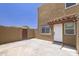 Back exterior shows a two-story stucco home with a tile roof detail and private fenced yard at 948 S Alma School Rd # 1, Mesa, AZ 85210