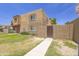 Charming townhome with a well-maintained lawn and attractive curb appeal at 948 S Alma School Rd # 1, Mesa, AZ 85210