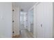 Bright hallway showcasing wood-look flooring and access to multiple rooms at 948 S Alma School Rd # 1, Mesa, AZ 85210
