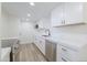 Bright kitchen featuring white cabinets, stainless steel appliances, and quartz countertops at 948 S Alma School Rd # 1, Mesa, AZ 85210