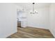 Bright kitchen features white cabinetry, stainless steel appliances, and modern lighting at 948 S Alma School Rd # 1, Mesa, AZ 85210
