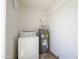 Functional laundry area with washer and dryer hookups and water heater at 948 S Alma School Rd # 1, Mesa, AZ 85210