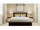 Inviting bedroom design with clean lines, a cozy bed, and ample natural light through blinds at 9522 W Avalon Dr, Phoenix, AZ 85037