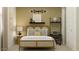 Bright bedroom featuring a rattan bed frame, cheerful decor, and a minimalist workspace at 9522 W Avalon Dr, Phoenix, AZ 85037