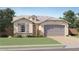 Charming single-story home with stucco exterior, gray shutters, and a well-manicured lawn at 9522 W Avalon Dr, Phoenix, AZ 85037