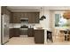 Well-designed kitchen featuring modern appliances, custom cabinets, and an island with seating at 9522 W Avalon Dr, Phoenix, AZ 85037