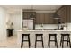 Modern kitchen features stainless steel appliances, white countertops, and sleek brown cabinetry at 9522 W Avalon Dr, Phoenix, AZ 85037