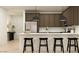 Modern kitchen features an island with seating and stainless steel appliances at 9522 W Avalon Dr, Phoenix, AZ 85037