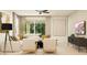 Bright and airy living room with neutral decor, stylish furniture, and access to outdoor space at 9522 W Avalon Dr, Phoenix, AZ 85037
