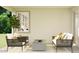 Cozy patio with comfortable seating, a modern fire pit, and lush greenery at 9522 W Avalon Dr, Phoenix, AZ 85037