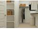 Well-organized walk-in closet featuring shelves, hanging rods, and ample storage space at 9522 W Avalon Dr, Phoenix, AZ 85037