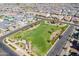 A beautiful aerial view of a neighborhood with a park, homes, and well-manicured lawns at 9645 E Ripple Dr, Mesa, AZ 85212