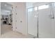 Bright bathroom featuring a glass enclosed shower and a large walk-in closet at 9645 E Ripple Dr, Mesa, AZ 85212