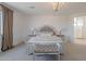 Serene bedroom with a plush bed, soft lighting, and neutral tones for a relaxing ambiance at 9645 E Ripple Dr, Mesa, AZ 85212