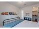 A modern bedroom featuring a metal bed frame and colorful wall décor at 9645 E Ripple Dr, Mesa, AZ 85212