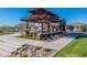Tranquil community pergola area with lush landscaping and inviting seating at 9645 E Ripple Dr, Mesa, AZ 85212