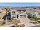 Aerial view of two story home with brick driveway and tile roof at 9645 E Ripple Dr, Mesa, AZ 85212