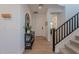 Stylish foyer featuring hardwood floors, decorative console table, and staircase at 9645 E Ripple Dr, Mesa, AZ 85212