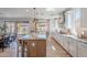 Modern kitchen featuring a large island, stainless steel appliances, and ample natural light at 9645 E Ripple Dr, Mesa, AZ 85212