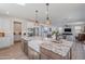 Well-equipped kitchen featuring an island, stainless steel appliances, and an open-concept layout at 9645 E Ripple Dr, Mesa, AZ 85212