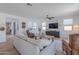 Inviting living room featuring a comfortable sofa, wood floors, and plenty of natural light at 9645 E Ripple Dr, Mesa, AZ 85212