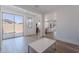 Spacious room with light wood floors and sliding glass doors that opens to the yard at 9645 E Ripple Dr, Mesa, AZ 85212