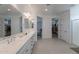 Open main bathroom featuring a long vanity and tiled floors at 9645 E Ripple Dr, Mesa, AZ 85212