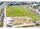 An aerial view of a meticulously kept neighborhood park with a playground and picnic area at 9645 E Ripple Dr, Mesa, AZ 85212