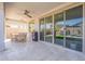 Relaxing covered patio with tiled flooring, ceiling fan, and outdoor dining area at 9645 E Ripple Dr, Mesa, AZ 85212
