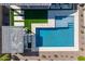 Aerial view of the sparkling pool and travertine tile backyard complete with a pergola and artificial turf at 9645 E Ripple Dr, Mesa, AZ 85212