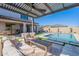 Inviting outdoor living space with a swimming pool, lounge area, and covered patio at 9645 E Ripple Dr, Mesa, AZ 85212