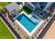 An aerial view of a backyard pool with a pergola, lounge chairs, and artificial turf at 9645 E Ripple Dr, Mesa, AZ 85212