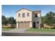 Inviting two-story home featuring a tiled roof, well-maintained lawn, and a charming, attached two-car garage at 10136 E Ursula Ave, Mesa, AZ 85212