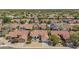 An aerial view showcases this neighborhood's well-spaced homes, mature trees, and overall serene ambiance at 10155 E Wood Dr, Scottsdale, AZ 85260