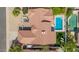 An aerial view of the roof, showing the backyard pool, patio furniture, and artificial turf at 10155 E Wood Dr, Scottsdale, AZ 85260
