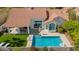 Aerial view of a landscaped backyard featuring a sparkling pool and covered patio at 10155 E Wood Dr, Scottsdale, AZ 85260