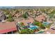 A luxurious backyard with pool, patio, green artificial turf, and mountain views at 10155 E Wood Dr, Scottsdale, AZ 85260