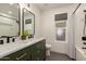 Stylish bathroom featuring dual sinks, subway tile, and modern fixtures at 10155 E Wood Dr, Scottsdale, AZ 85260