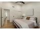 Bright bedroom featuring recessed lights, light wood floors, and closet space at 10155 E Wood Dr, Scottsdale, AZ 85260