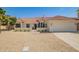 Charming single-story home with a well-manicured yard and a neutral color palette at 10155 E Wood Dr, Scottsdale, AZ 85260